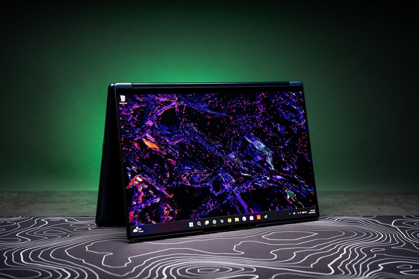 A 2-in-1 Lenovo Yoga 9n laptop folded over into tent mode.