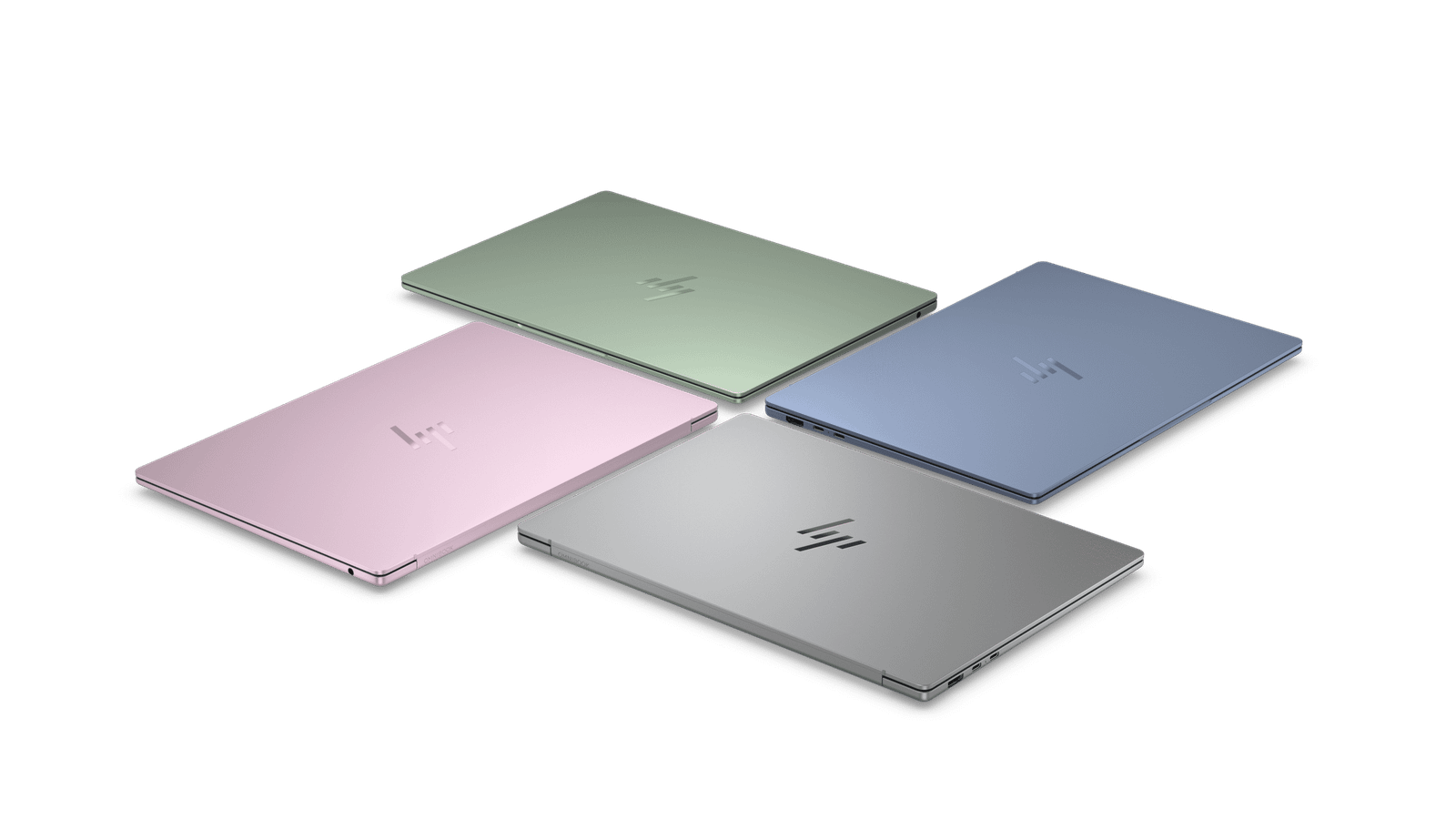 Four colorful HP OmniBook 5 14 laptops arranged in a circle with their lids closed, showing their chassis colors. They are shown in green, blue, silver, and pink.
