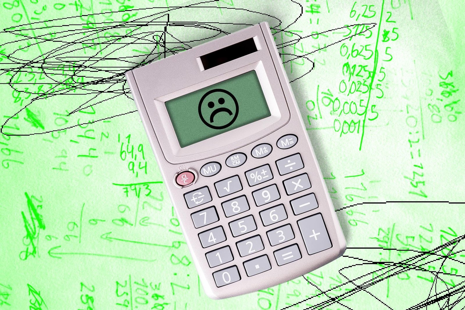 Frowning calculator on a background of math writing.