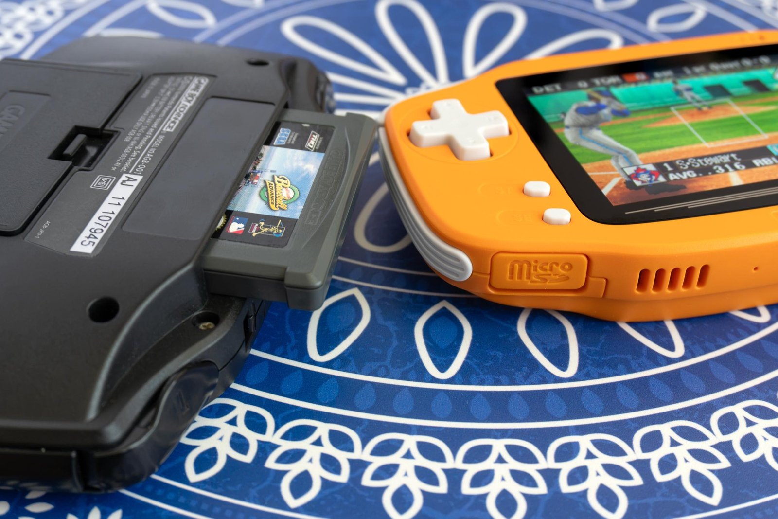 The Ayaneo Konkr Pocket Advance next to an upgraded Game Boy Advance with a game cartridge half inserted. The Ayaneo Konkr Pocket Advance next to an upgraded Game Boy Advance with a game cartridge half inserted.