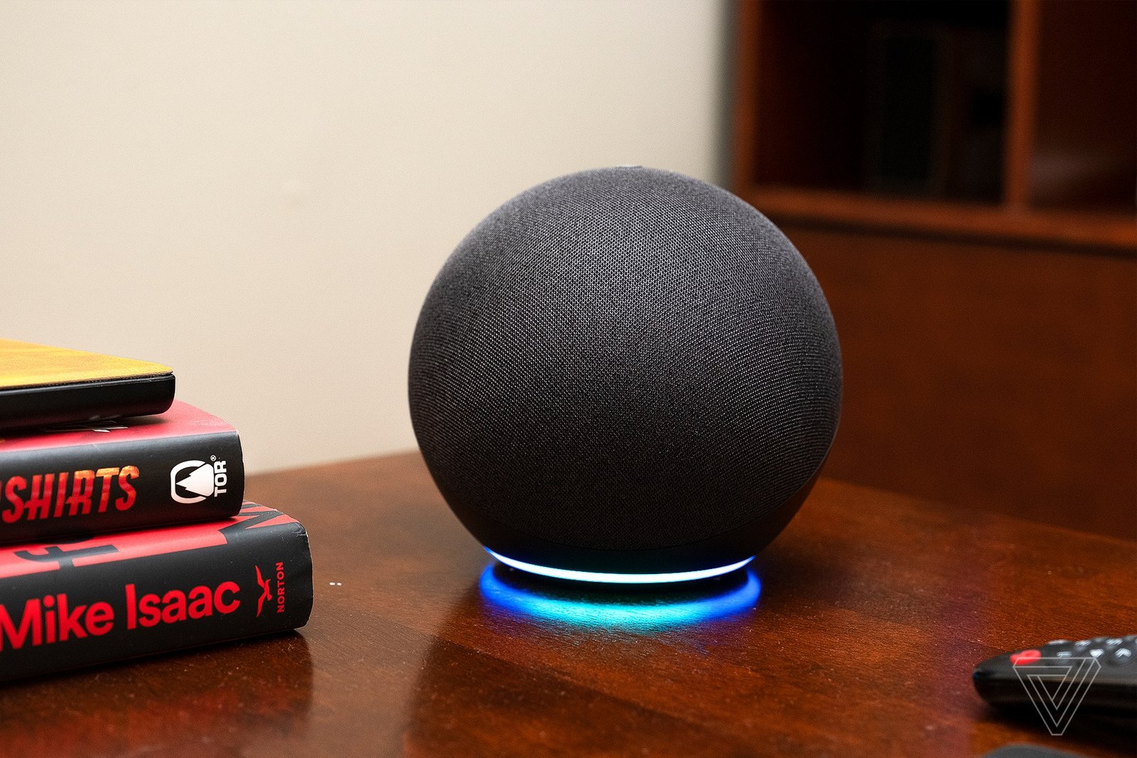 The fourth-gen Echo smart speaker on a wooden desk