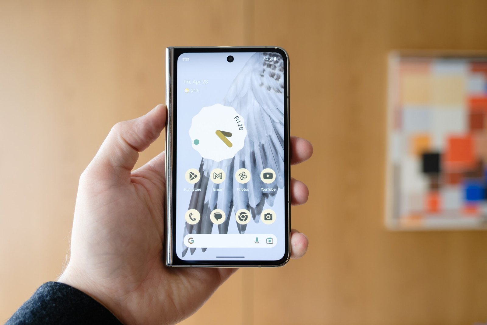 A closed Pixel Fold held up in a hand.