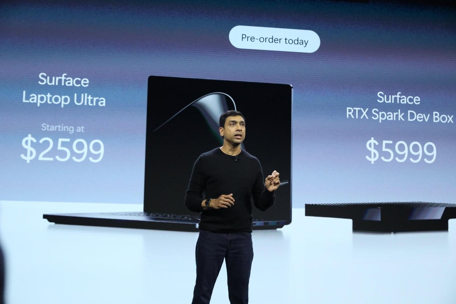 A photo of Windows and Surface chief Pavan Davuluri announcing the Surface Laptop Ultra and RTX Spark Dev Box prices.