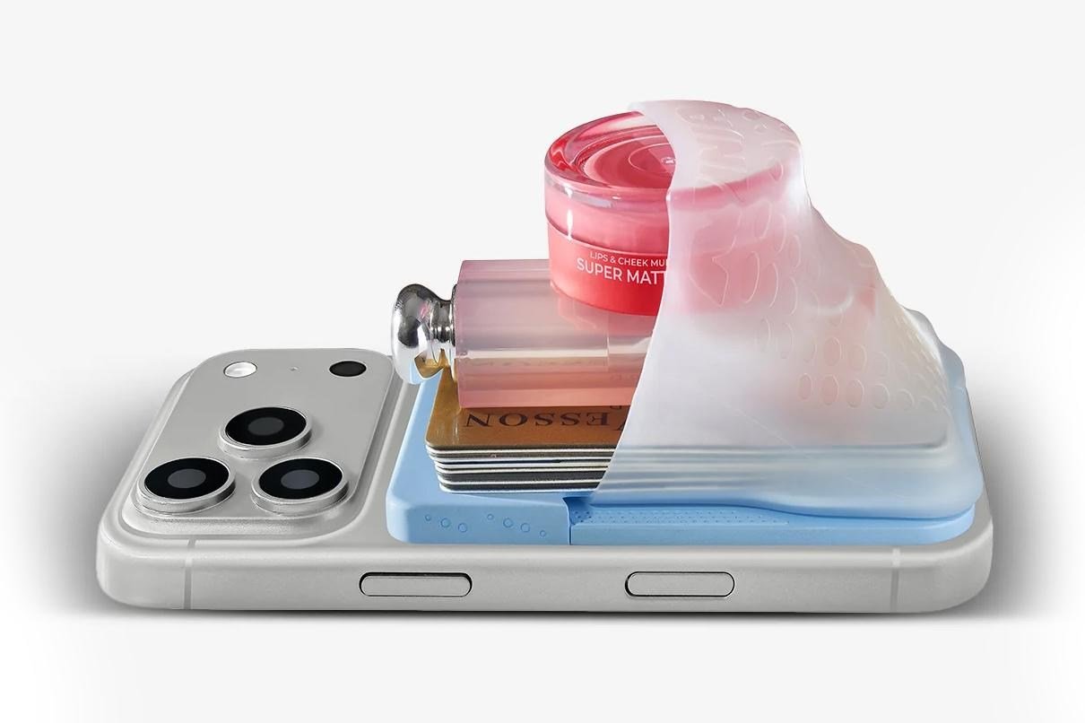 The Ninja Labs MagSafe Flex Pouch stuffed with various items attached to the back of a phone.