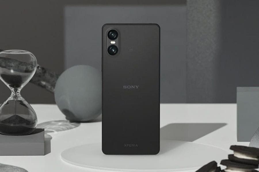 The Sony Xperia 10VI smartphone surrounded by an hour glass and cookies.